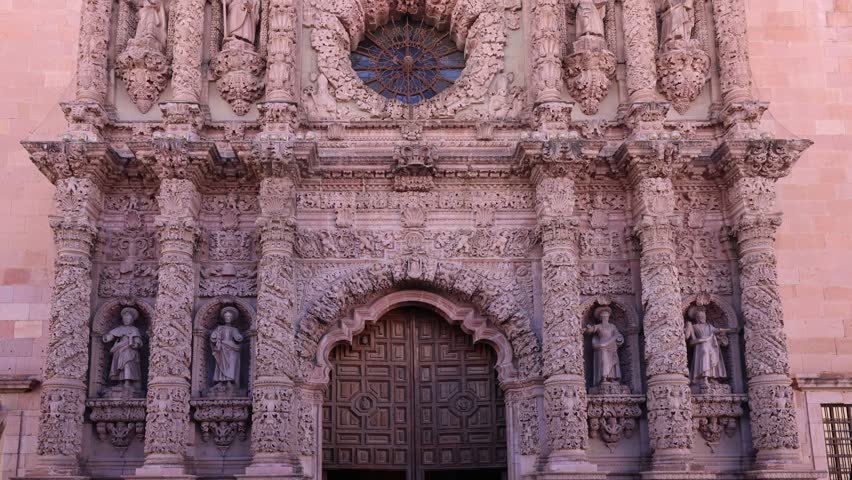 View of the ornate baroque stone facade of the Zacatecas Cathedral with intricate carvings and statues in Zacatecas, Zacatecas, Mexico.