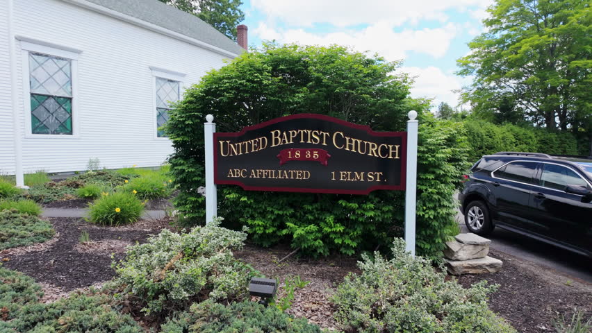 Topsham Maine United Baptist Church sign outside a white clapboard chapel