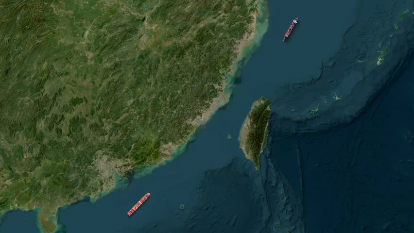 Two large cargo ships navigating the strategic Taiwan Strait
