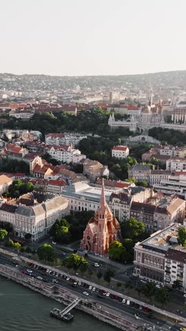 Budapest aerial cityscape gothic church vajdahunyad castle rooftops sunset hungary panorama landmark architecture vertical