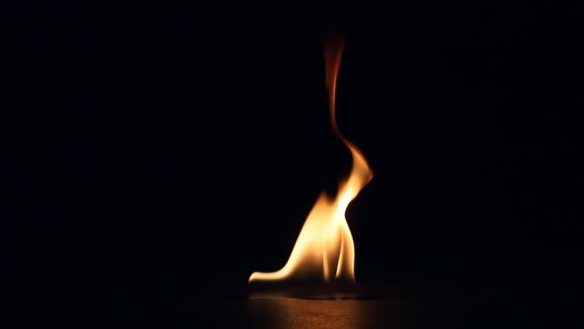 Single realistic fire flame burning, flickering, and gradually dying out isolated on a pure black background for VFX overlay and compositing.