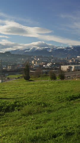 Man walking with dog overlooking Oviedo and snowy mountains in Spain.

Lifestyle travel scene featuring a man walking his dog with panoramic city views and the snow-capped Picos de Europa creating an unforgettable backdrop.