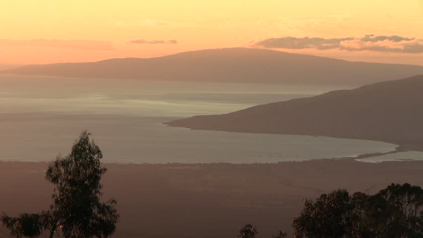 Peaceful Maui Coastline at Sunset with Mountains