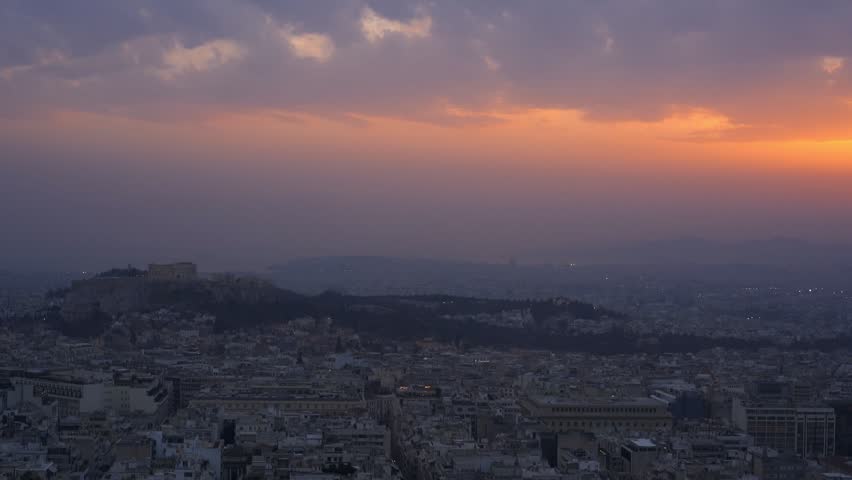 Athens city at sunset with Parthenon and Acropolis seen from Lycabettus hill viewpoint at sunset in Greece
