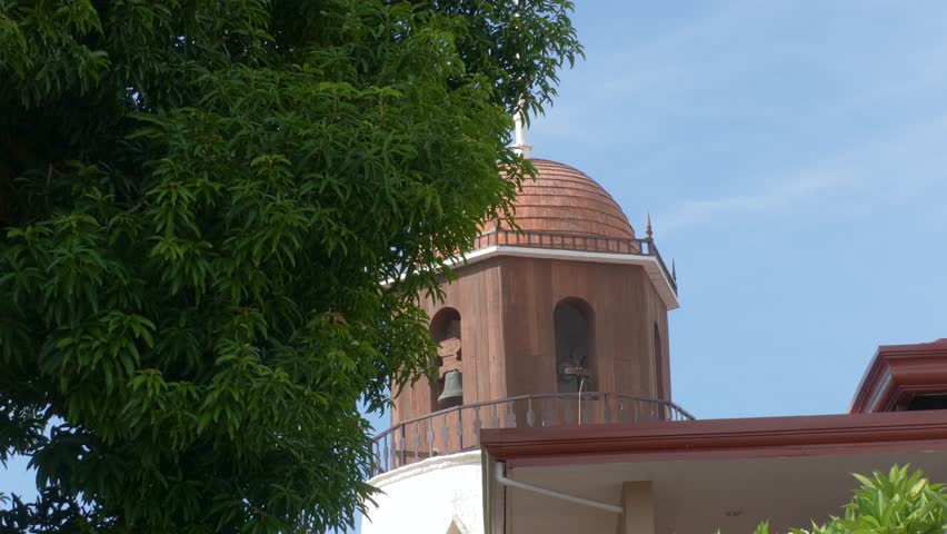 Iconic stock footage of the classical bell tower of St. Catherine of Alexandria Church in Dumaguete City, Negros Oriental.