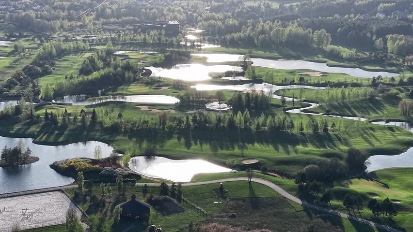 Scenic golf resort landscape with water and green fairways
