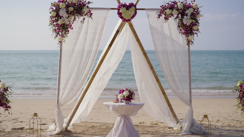 Wedding beach set up arch floral roses. Setting stage festive marriage wedding western outdoor.
