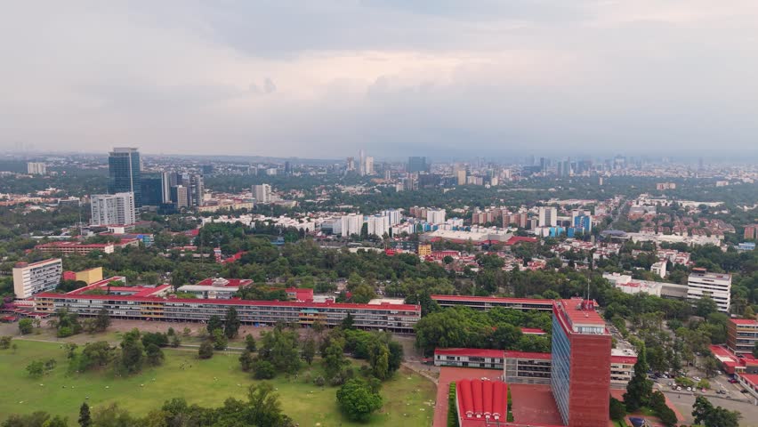 Elevated view of academic complex surrounded by urban landscape