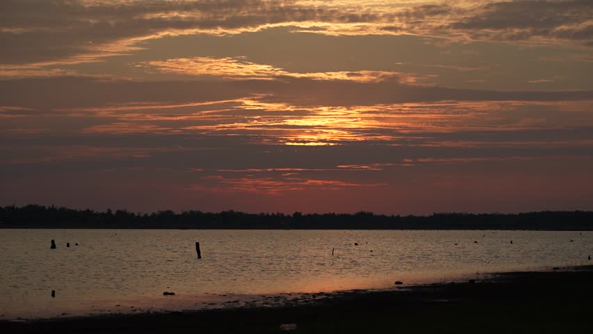 Sun set in the evening behind reservoir