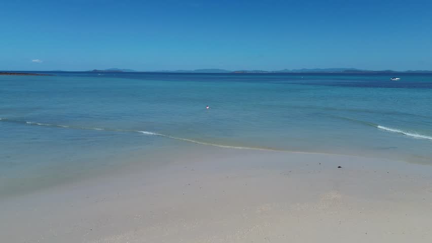 Aerial 4K drone footage of Keppel Island Queensland Australia. Tropical island beach and coral reef from above.