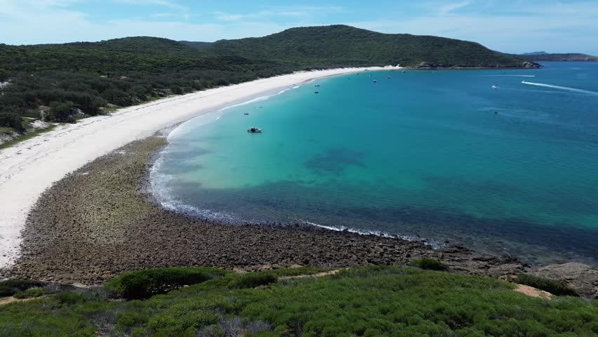 Aerial 4K drone footage of Keppel Island Queensland Australia. Tropical island beach and coral reef from above.