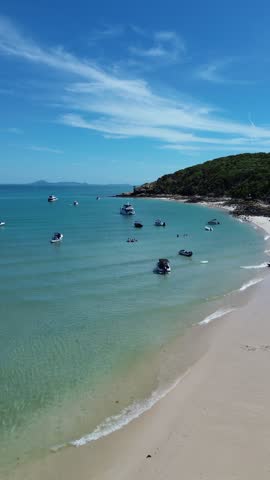 Vertical 4K drone footage of Keppel Island Queensland Australia. Tropical island beach and coral reef from above.
