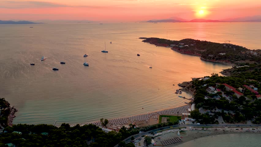 Panoramic aerial view of the popular Astir Beach at Vouliagmeni, south Athens coast, Greece, during a beautiful summer sunset