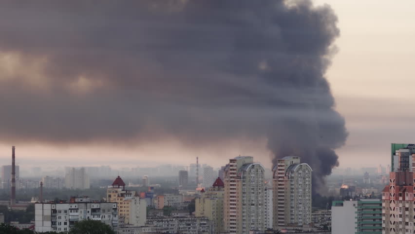 Kyiv, Ukraine - July 2, 2026: Huge column of thick black smoke rising high over the city skyline after a Russian missile and drone attack
