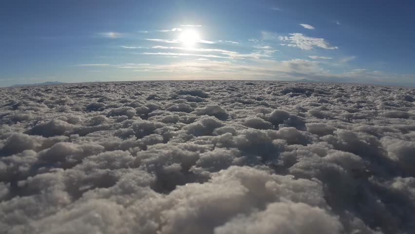 Low Angle View Of Salar De Uyuni Salt Flats At Sunset In Bolivia