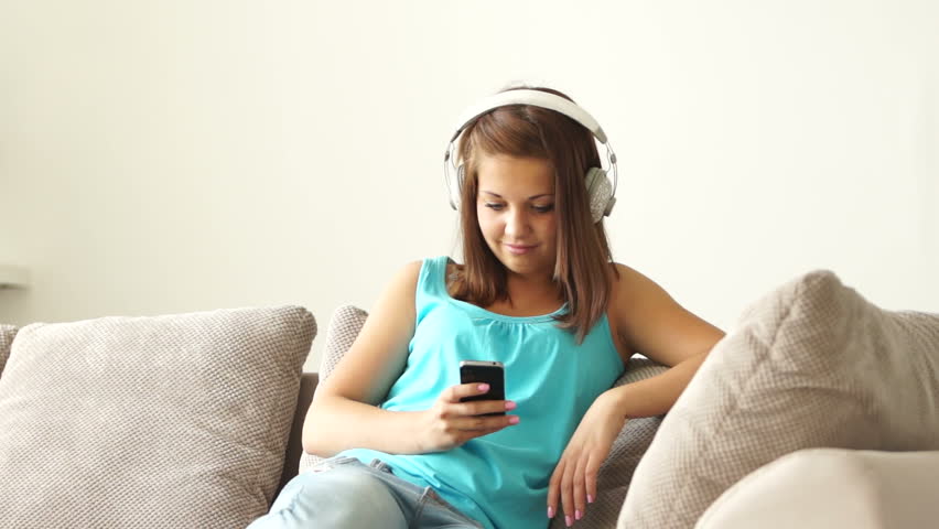 Girl listening to music and stretches
