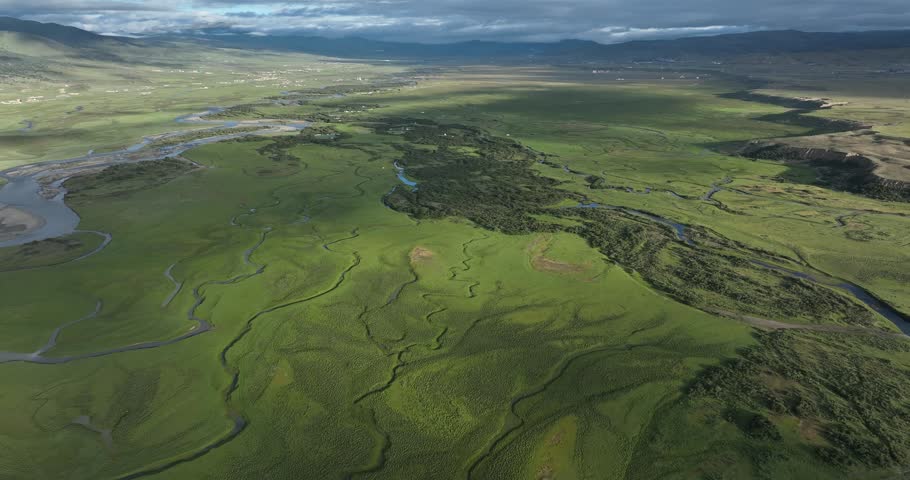 Beautiful curving rivers and green grassland in Litang county, China