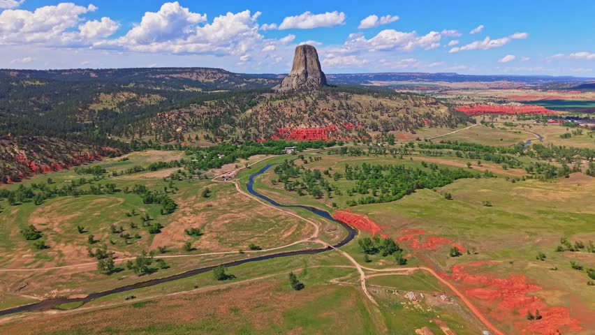Scenic aerial view of Devils Tower National Monument under clear skies in Wyoming