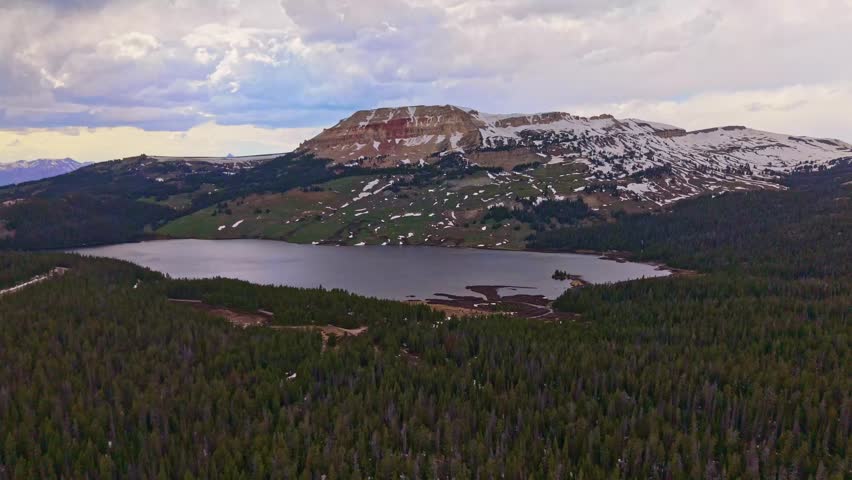 Scenic aerial view of Beartooth Lake with a rugged mountain range in the foreground in Wyoming