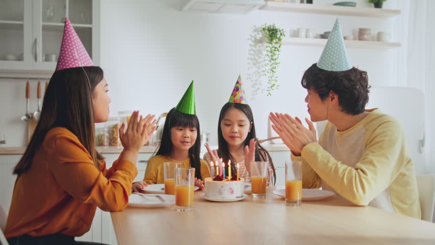 Happy Children Celebrating Birthday With Cake And Candles, Family Gathering At Home