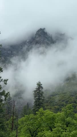 mountains in clouds or fog, Yosemite National Park, California, USA