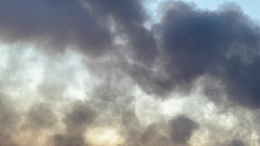 Kyiv, Ukraine - June 2, 2026: Consequences of war shelling showing a dense smoke plume pluming from a hit site behind multi-story apartment buildings