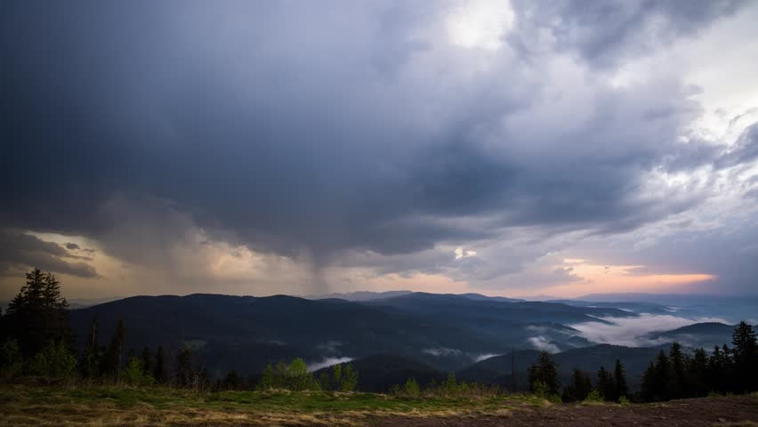 Overcast clouds covered the sky over the Rhodope Mountains with spruce forests and meadows