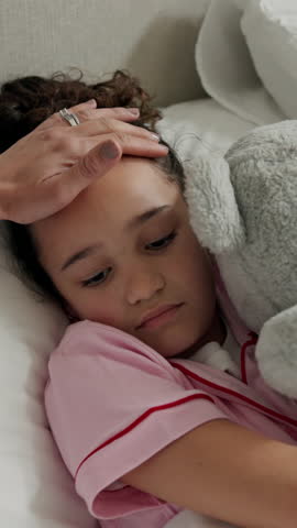 Girl, parent or sick child with teddy bear in home for fever, medical attention or monitoring health. Tired, kid or flu with cold symptoms, hayfever or sinus for allergy, virus or infection in house