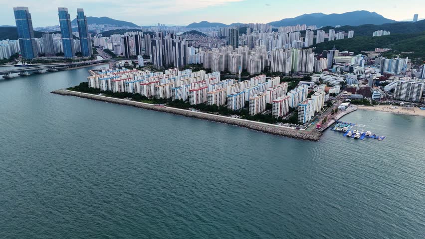 Impressive cityscape of gwangalli and namcheon in busan, south korea, showing a peninsula of apartment buildings and skyscrapers