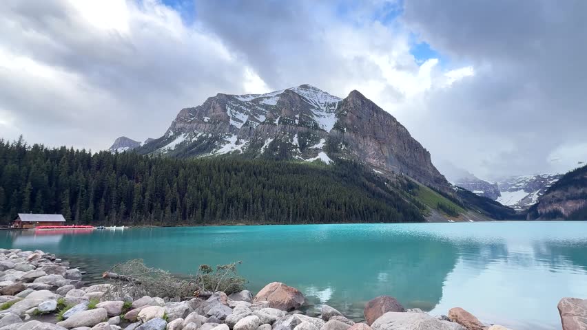 Beautiful lake and mountains in Banff National Park with blue water and trees in summer