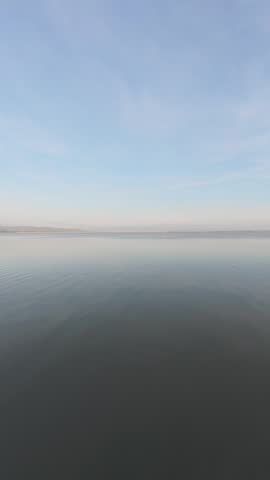 Calm Water Reflecting Sky. Morning in the lakeside