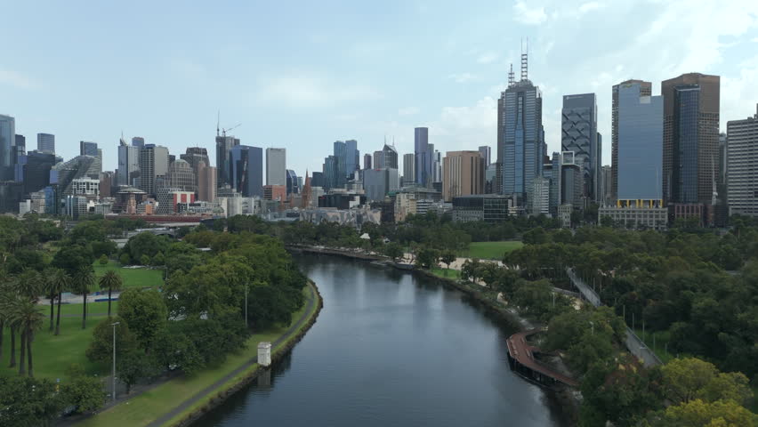 Aerial view gliding above the Yarra River toward Melbourne