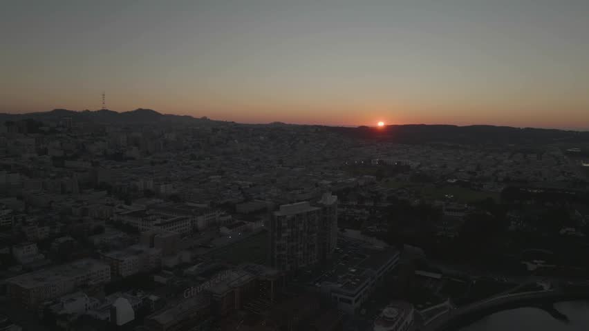 Horizontal pan from city to river in soft sunset light, San Francisco