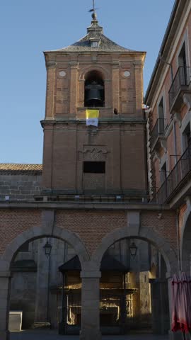 Historic Brick Bell Tower With Arched Arcade and Stone Columns Below