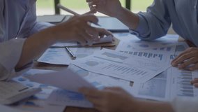 Business people discussing financial charts with digital gears overlay, representing teamwork, data analysis, workflow automation and business process planning. - Powered by Shutterstock - Get 15% off with code: PIKWIZARD15