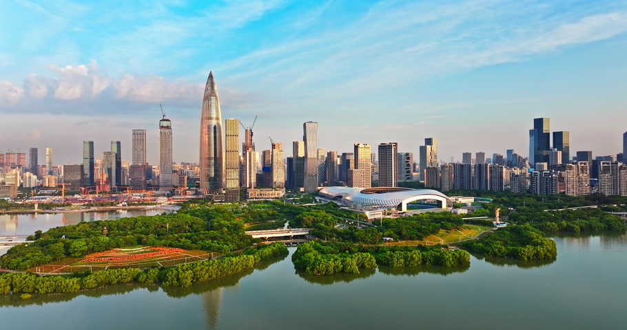 Aerial view of the modern city skyline with skyscrapers and a waterfront sports park in Shenzhen Bay, Shenzhen, China