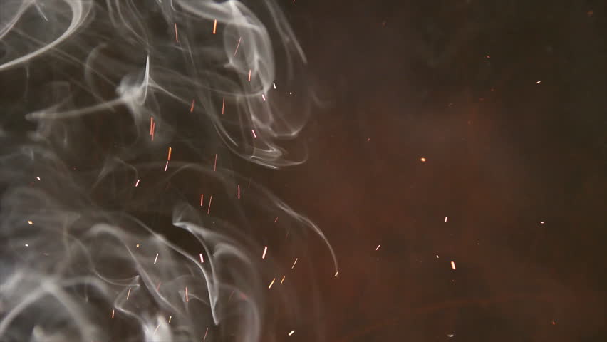 Seamless loop of fire sparks and realistic smoke overlay background