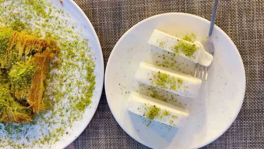 Traditional Turkish Dessert Platter with Kadayıf and Dondurma Ice Cream on a Rustic Table