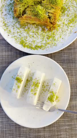 Traditional Turkish Dessert Platter with Kadayıf and Dondurma Ice Cream on a Rustic Table