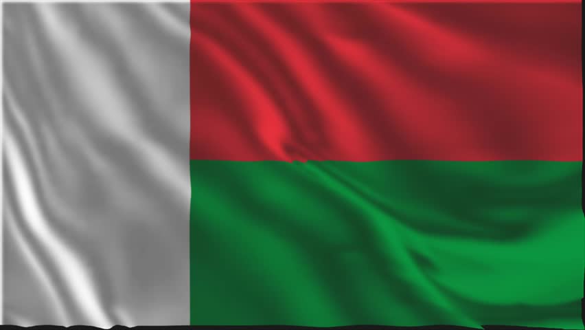 Flag of Madagascar waving slowly in the foreground.