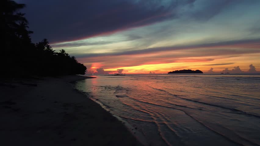 Vibrant Sunset Over Tropical Ocean Horizon