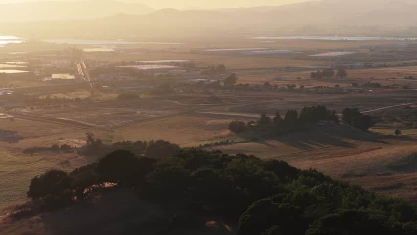 Sunset Arc Over Treed Ridge: Farmland Valley to Bay, Telephoto Aerial, CA