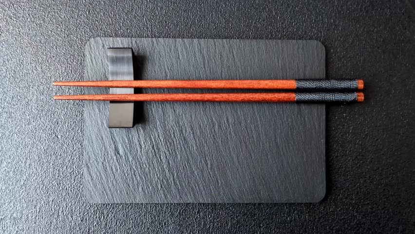 Wooden bamboo chopsticks for sushi and other Asian food with a blank background. Wooden chopsticks