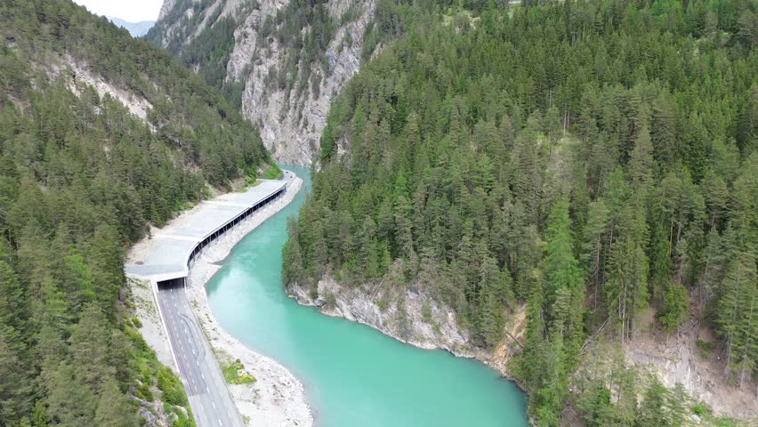An aerial view of the riverside Minger gallery in the Engadine high valley in Switzerland during daytime