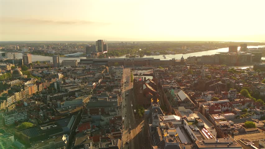 Amsterdam Aerial Drone Flight Above City Center Toward IJ Waterfront with Dense Cityscape