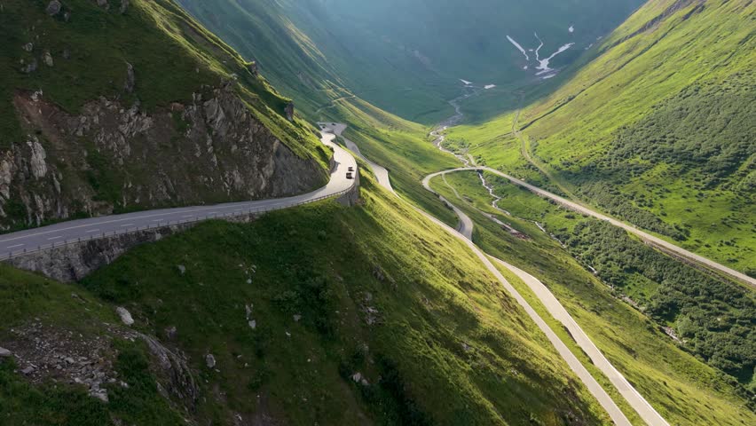 Furkapass Switzerland welcomes you to an unforgettable journey through majestic mountains. Experience the awe as you drive along scenic roads surrounded by lush greenery and valleys.