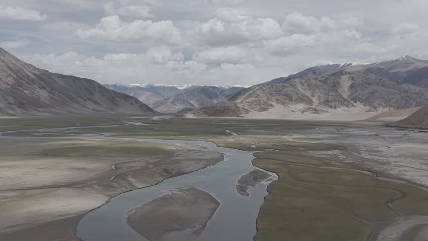 Beautiful high-altitude mountain landscape in Ladakh with dramatic rocky terrain and clear skies.