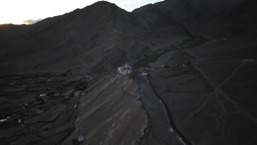 Beautiful high-altitude mountain landscape in Ladakh with dramatic rocky terrain and clear skies.