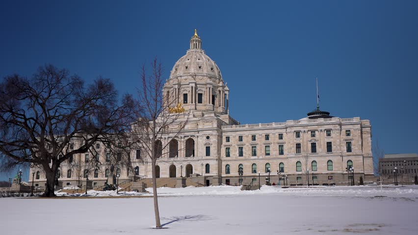 Explore the Minnesota state capitol in Saint Paul on a bright day with snow covering the ground.