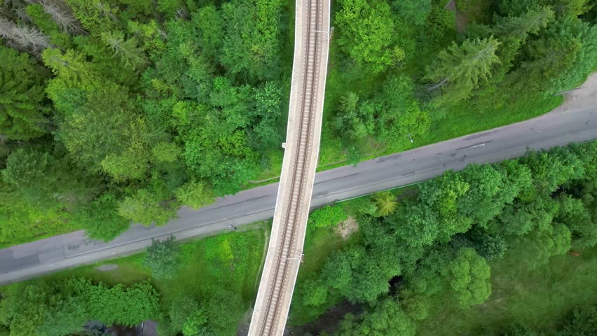 Aerial flight above forest dirt road and mountain cabin in the Beskids Poland ,wisła 